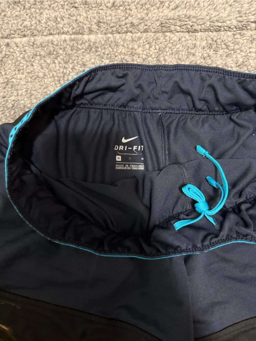 Nike Women's Navy Shorts with Blue Waistband and Teal Swoosh
